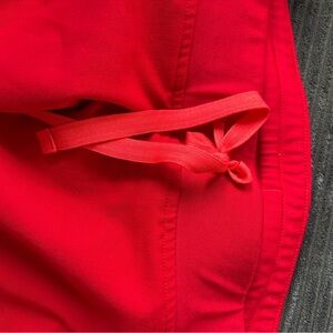 EUC Figs Vibrant Red joggers medium tall